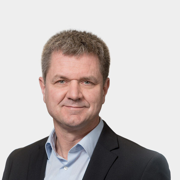 Ulrich Krieg, Partner Portraetfoto von Ulrich Krieg vor grauem Hintergrund