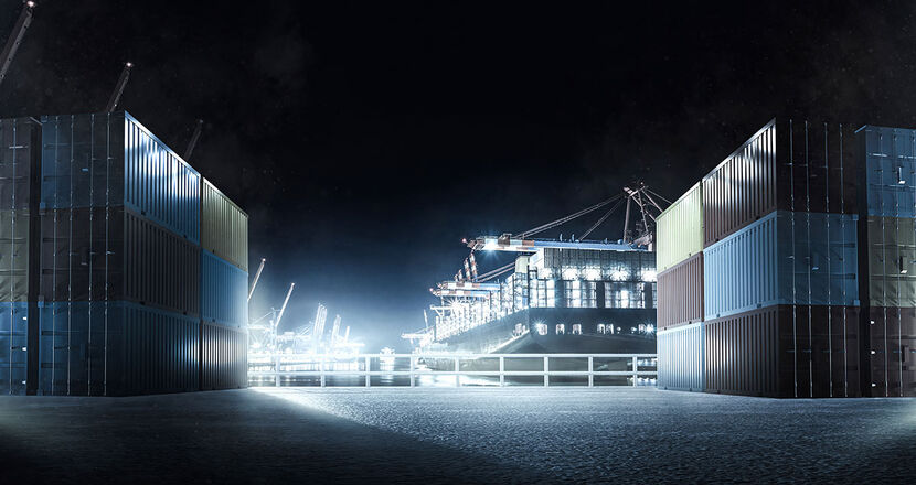 A container yard of a port at night which is illuminated.