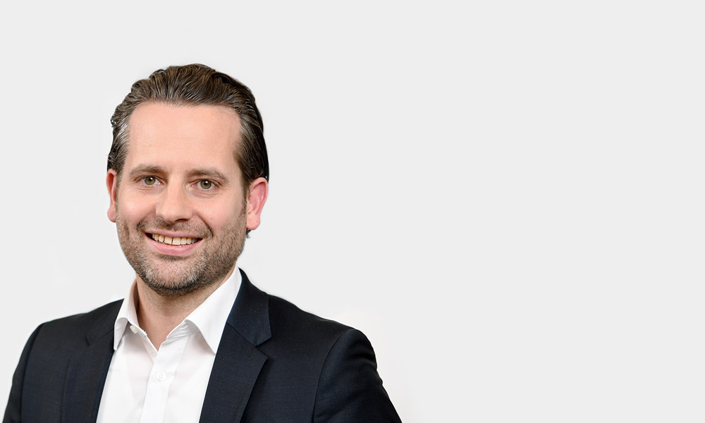 Kai Magenheimer, Partner Portraetfoto von Kai Magenheimer vor grauem Hintergrund